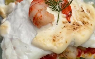 Bacalao asado sobre patatas